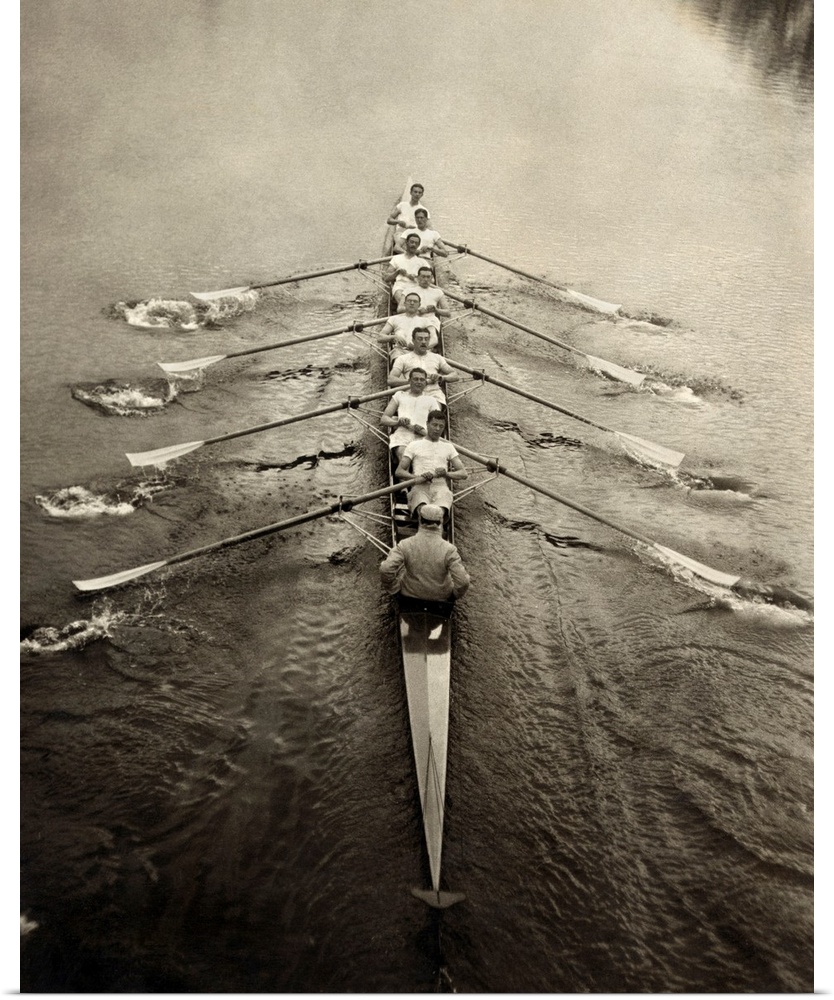 The Cambridge rowing team on a river. Photograph, c1913.