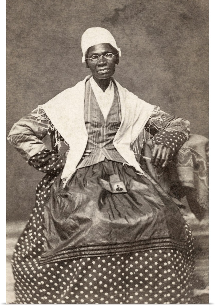 SOJOURNER TRUTH (c1797-1883). Born Isabella Baumfree. American abolitionist and women's rights activist. Holding a photogr...