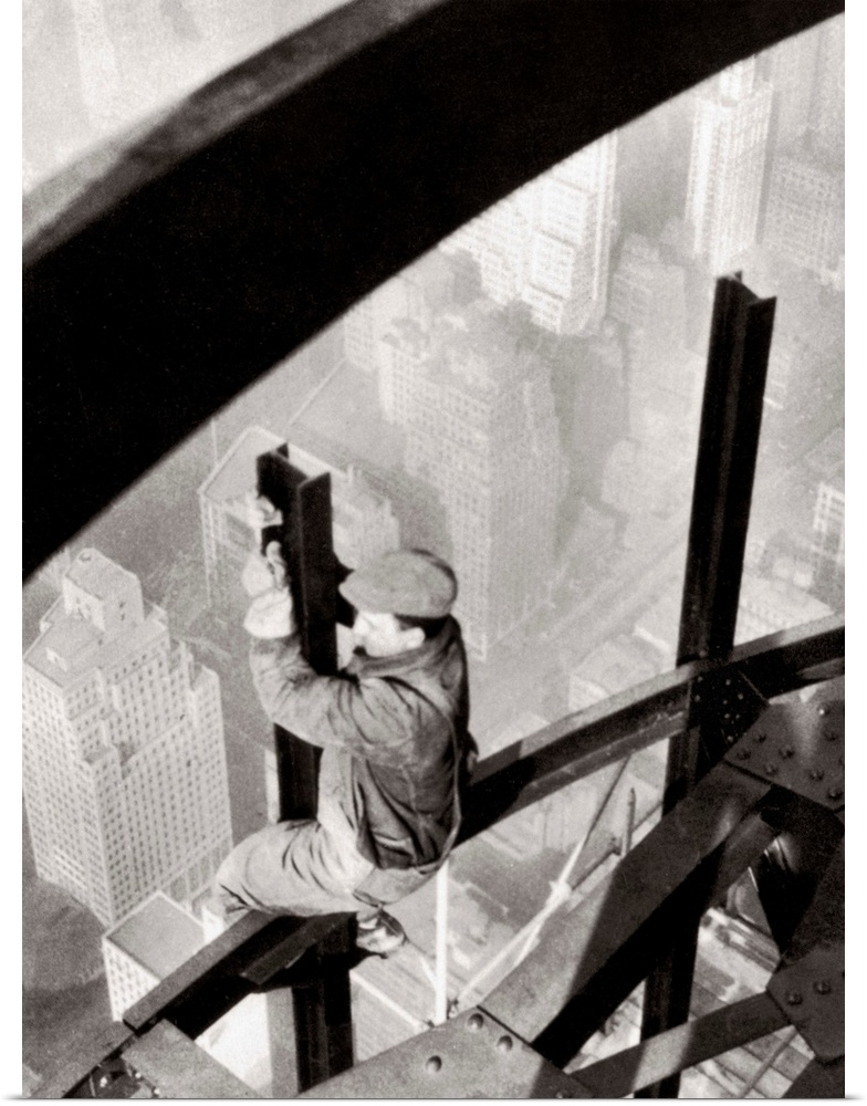 Steelworker atop the Empire State Building, New York City, during its construction. Photograph by Lewis Hine, 1931.