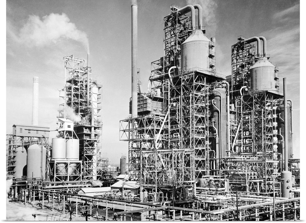 Three oil refinery units in Louisiania, which use the process of 'cracking,' set up to supply fuel for allied units fighti...
