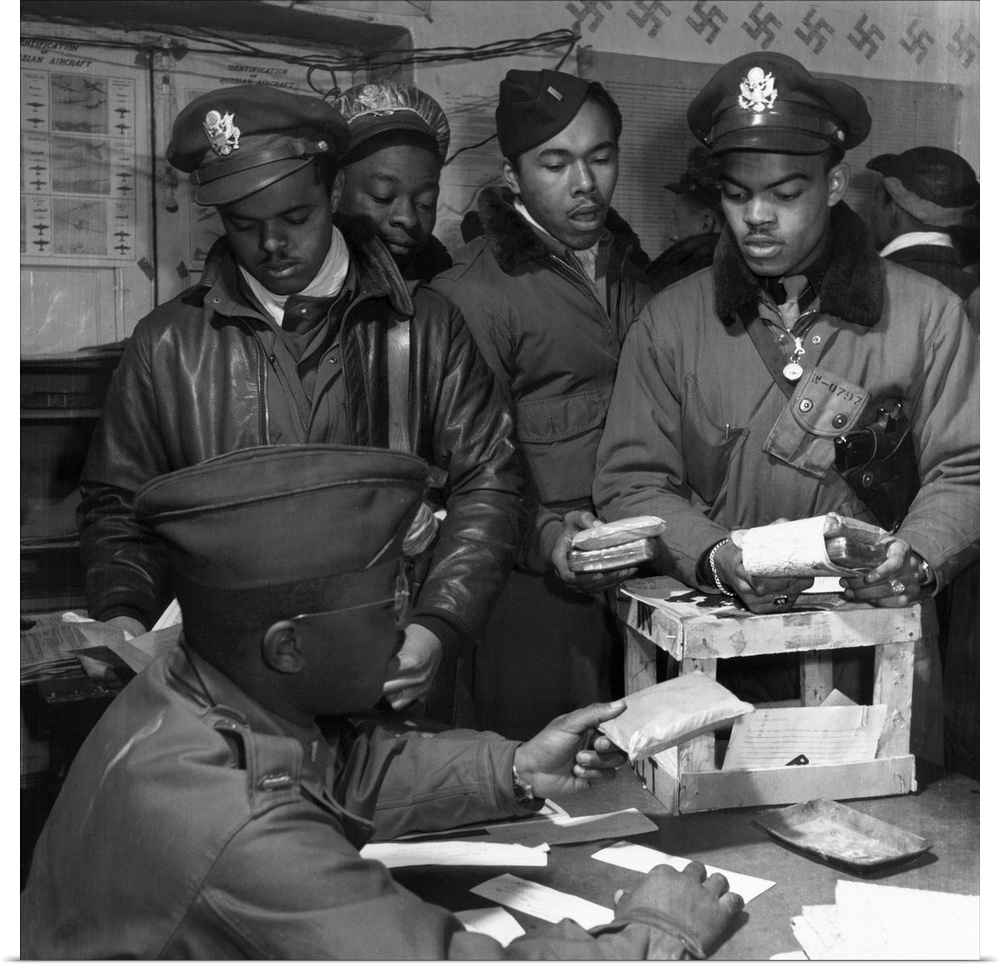 Fighter pilots of the Tuskegee Airmen 332nd Fighter Group receive 'Escape kits' (cyanide) at Ramitelli Airfield, Italy. Ph...