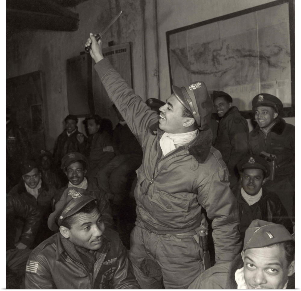 Members of the Tuskegee Airmen 332nd Fighter Group at a briefing at Ramitelli Airfield, Italy, March 1945. Photograph by T...