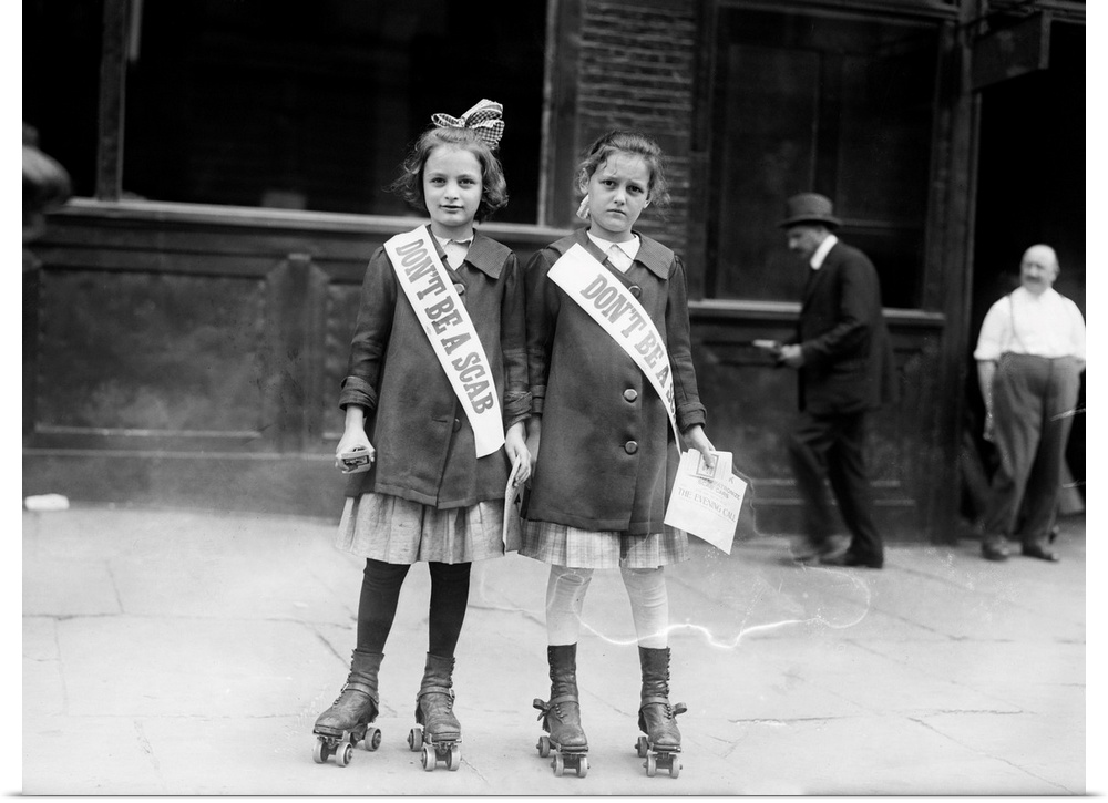 Two young strike sympathizers on rollerskates, probably in New York City. Photograph, c1915.