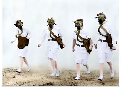 U.S. Army nurses advance through a cloud of smoke in a gas mask drill during training