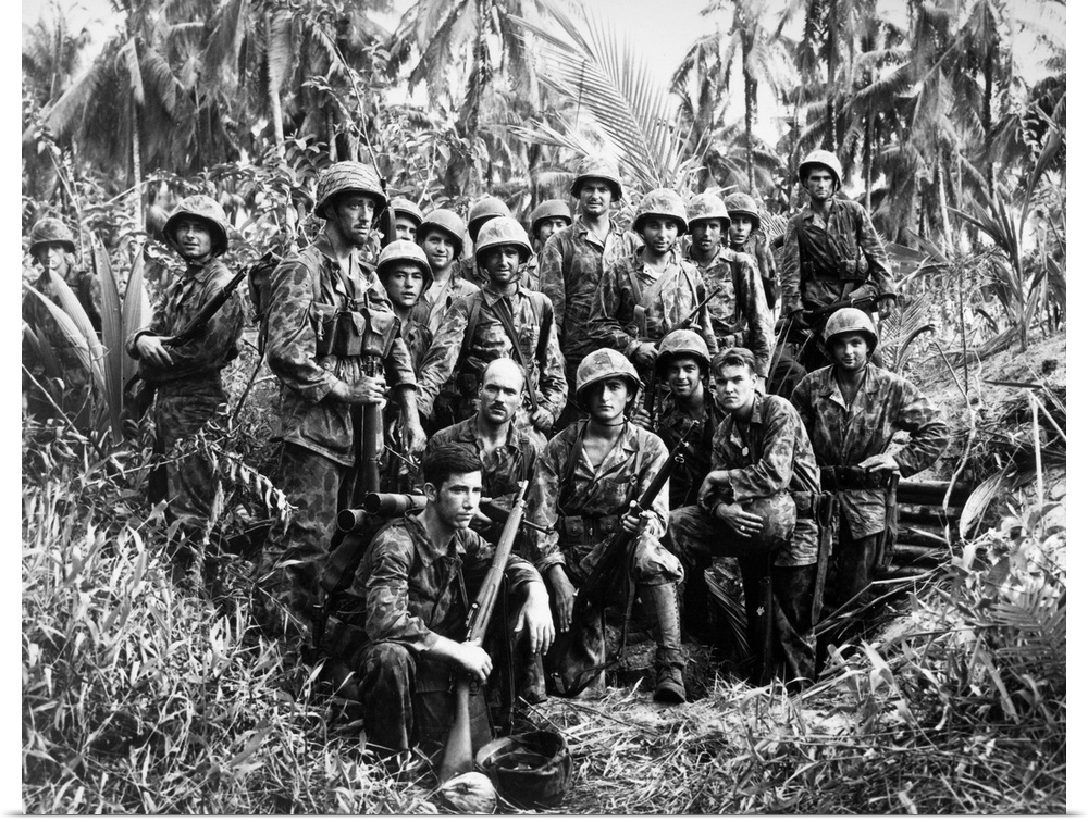 U.S. Marine Raiders posing in front of a Japanese dugout which they helped capture at Cape Torokina, Bougainville, New Gui...