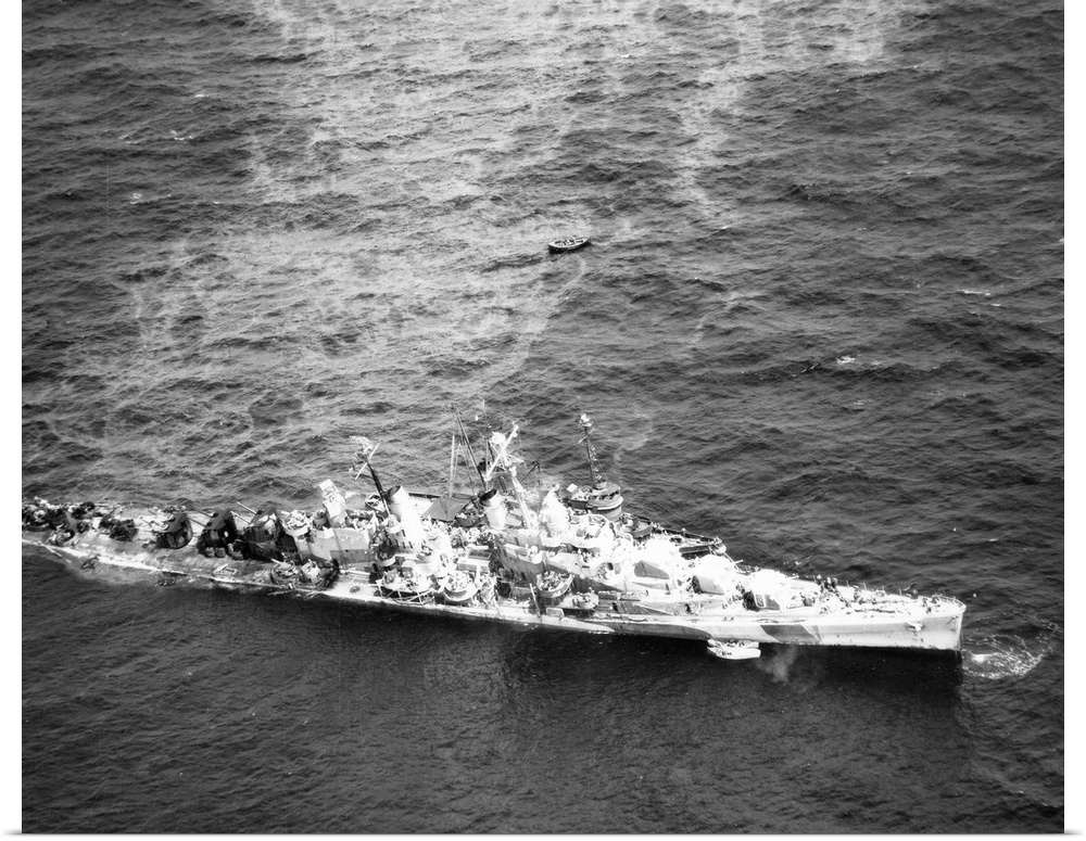 Aerial view of the USS Reno after being torpedoed, photographed alongside the USS Zuni, 5 November 1944.