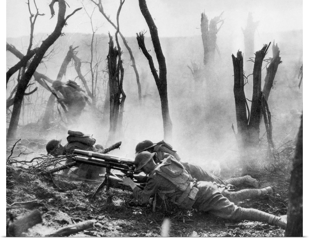 American machine gun crew of Regimental HQ Co., 23rd Infantry, 2nd Division, firing a 37mm gun during an advance through B...
