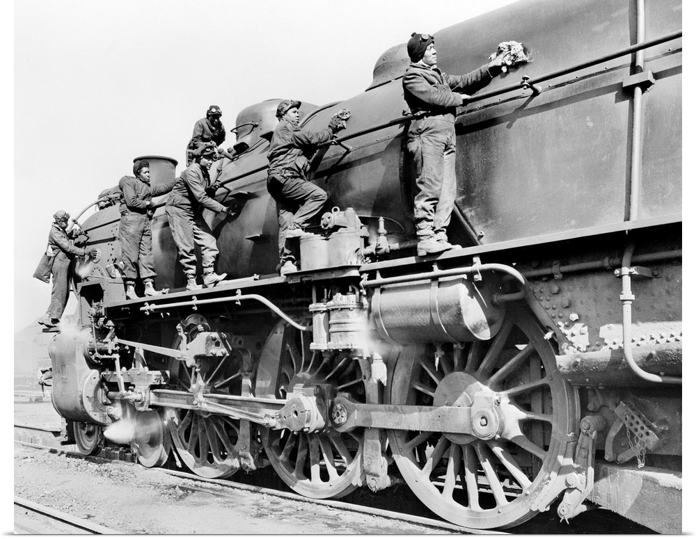Women engine cleaners on the Pennsylvania Railroad, taking the place of men fighting in World War II. Photograph by Alfred...