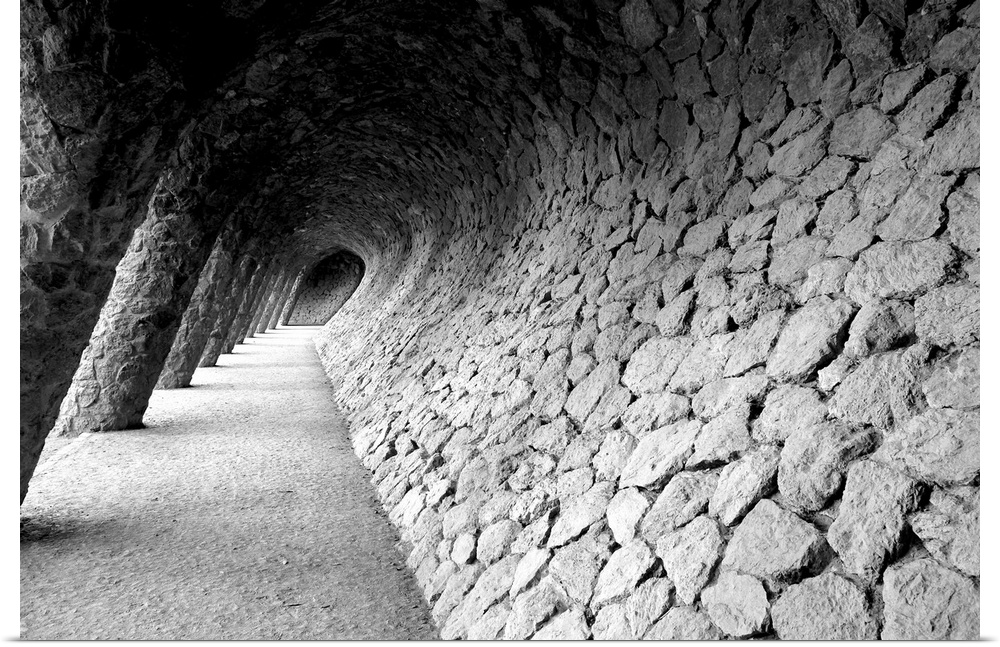 Black and white photograph of a distorted stone wall pathway.