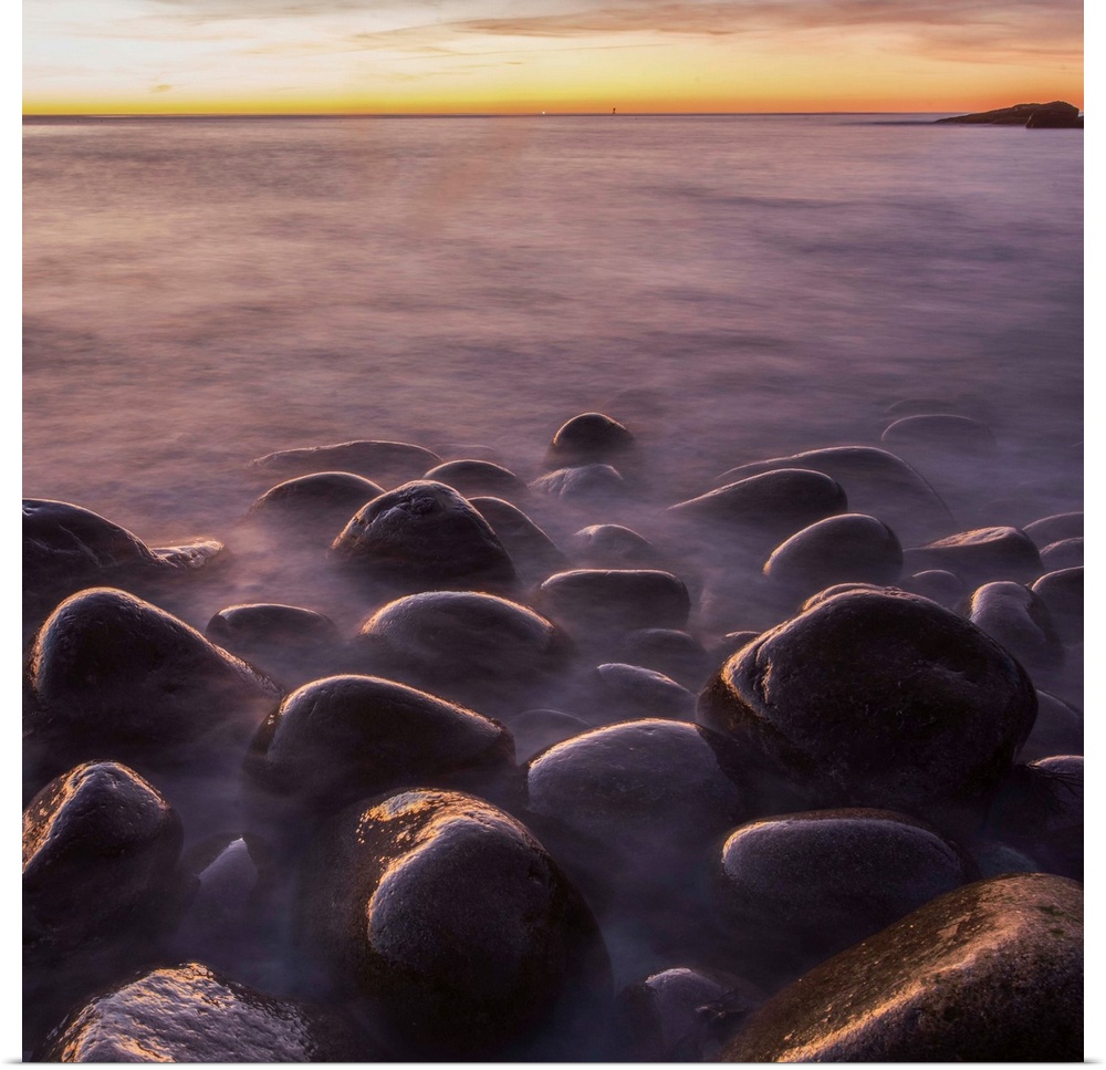 Smooth round rocks on the beach in Acadia National Park, Maine.