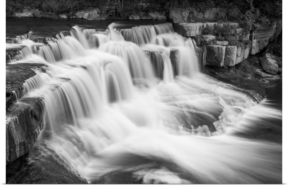 Black and white image of a rushing waterfall in Ithaca, New York.