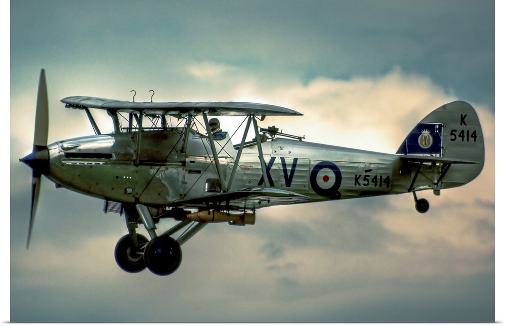 A 1935 Hawker Hind flying on a cloudy day