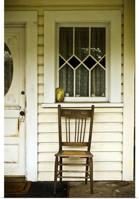 A chair on a porch
