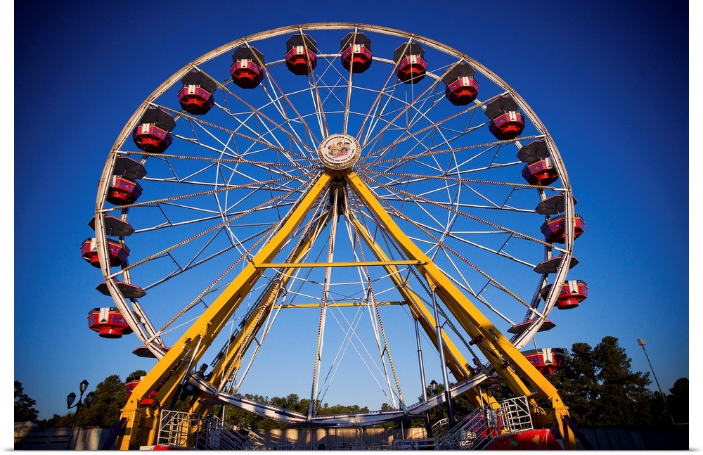 A colorful Ferris Wheel at the North Carolina State Fair in Raleigh, NC.