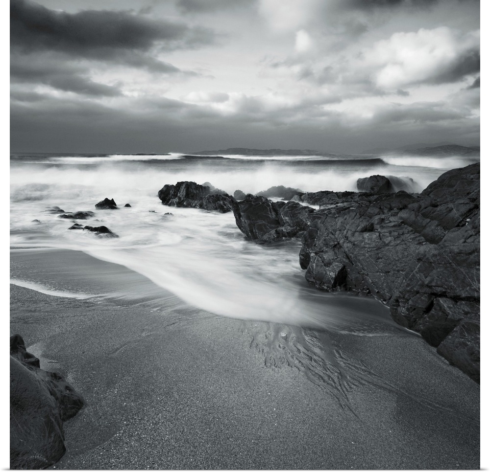 A peaceful cove with sand and surf