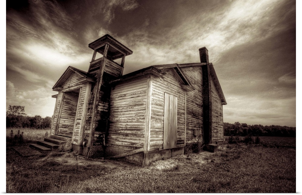 A timber shack with dramatic sky