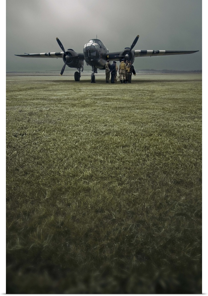 A B-25 Mitchell bomber and crew at dawn in portrait.