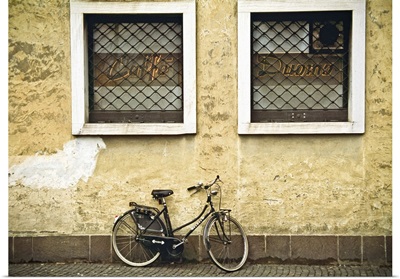 Bicycle on yellow wall