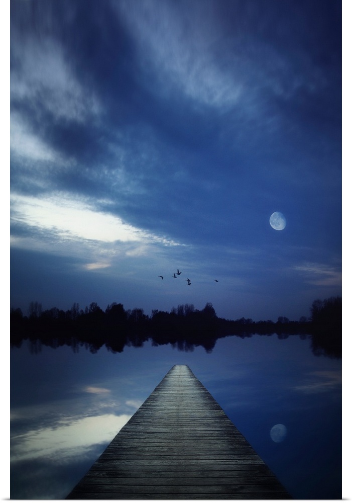 Night scene of a lake seen from a jetty with the moon shining and some birds flying over