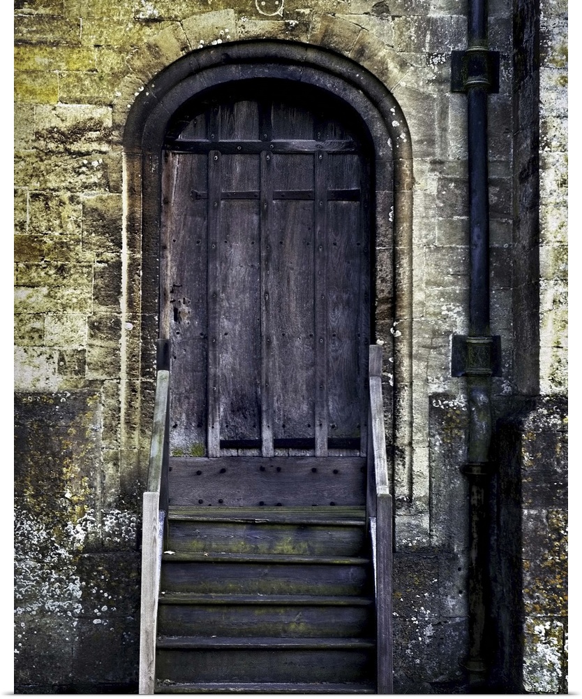 An old doorway with wooden steps