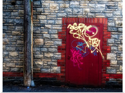 Derelict door with graffiti and lampost