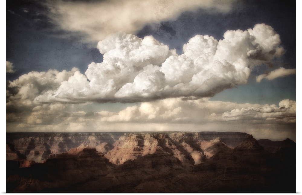 Huge canyon in the background looking across the Grand Canyon in USA with clouds in a blue summer sky with texture layer