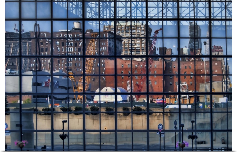 Reflection of a construction site and other buildings in the windows of the Jacob K. Javits Center, Manhattan, New York City.