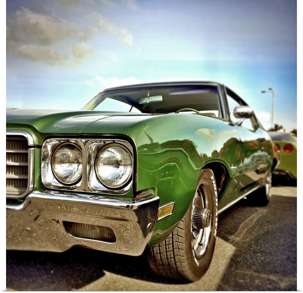 Green classic USA car form the 1970's with chrome fenders.