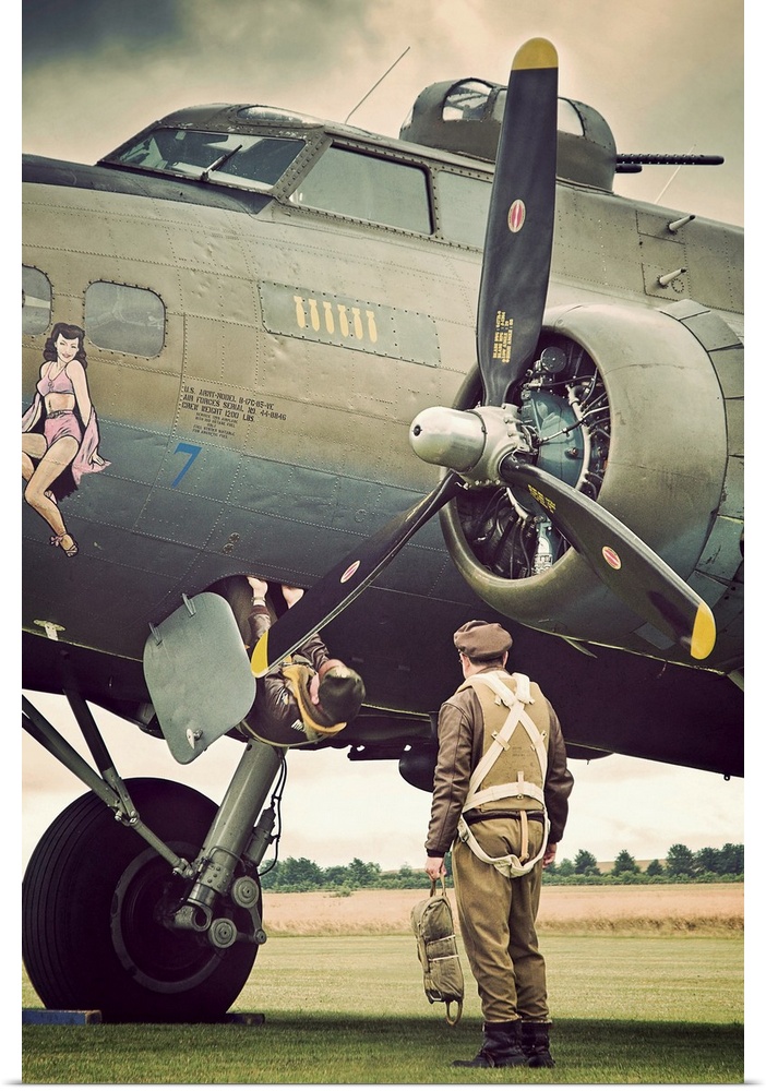 Pilots climbing onboard a B-17G Flying Fortress bomber.