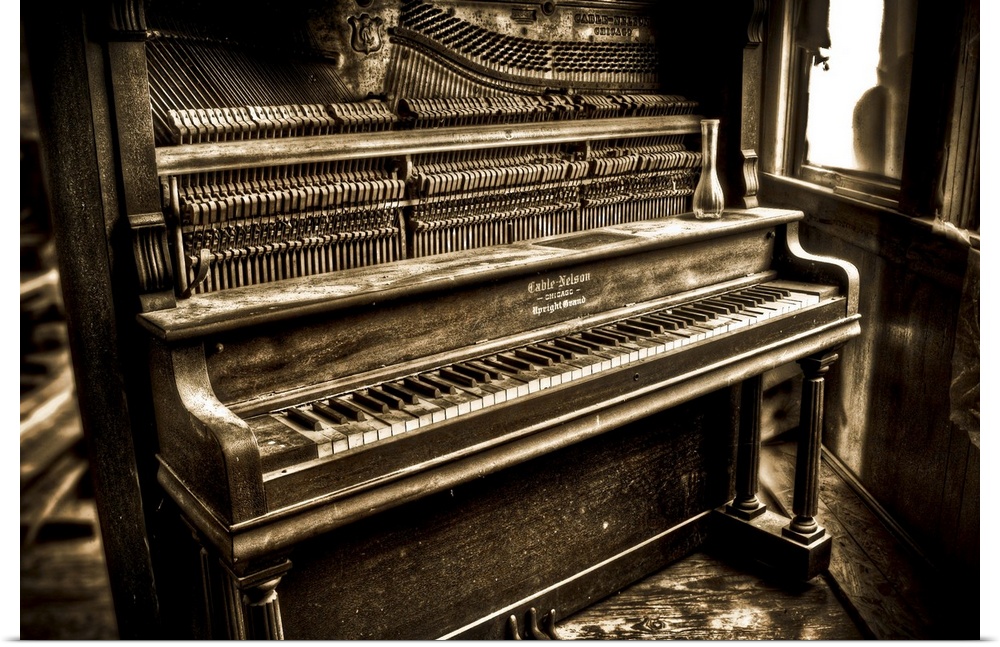 An old upright pianoforte with an open front
