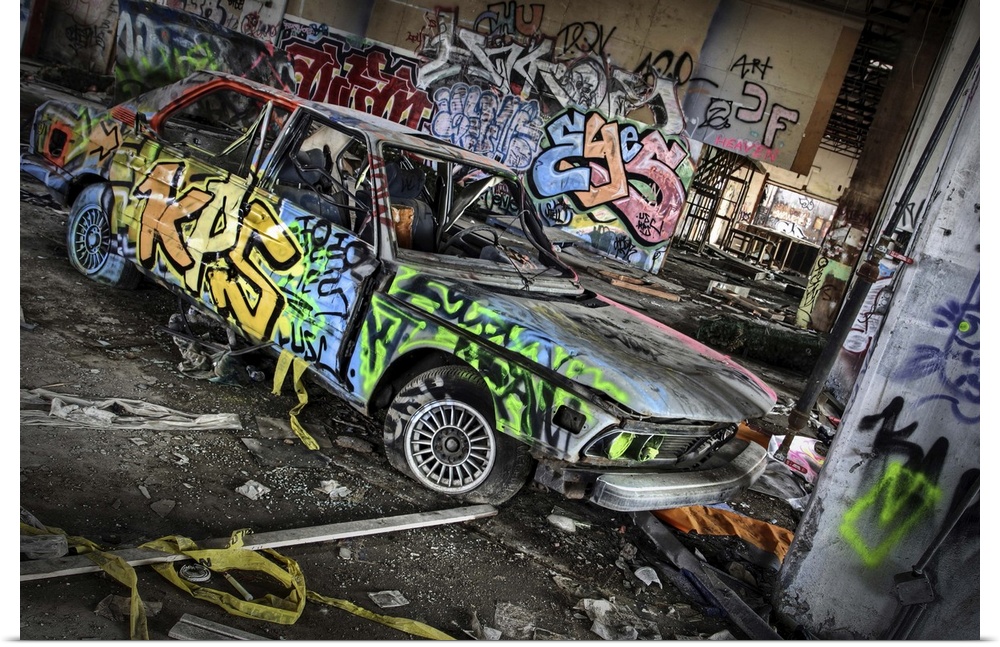 An old BMW car with graffiti