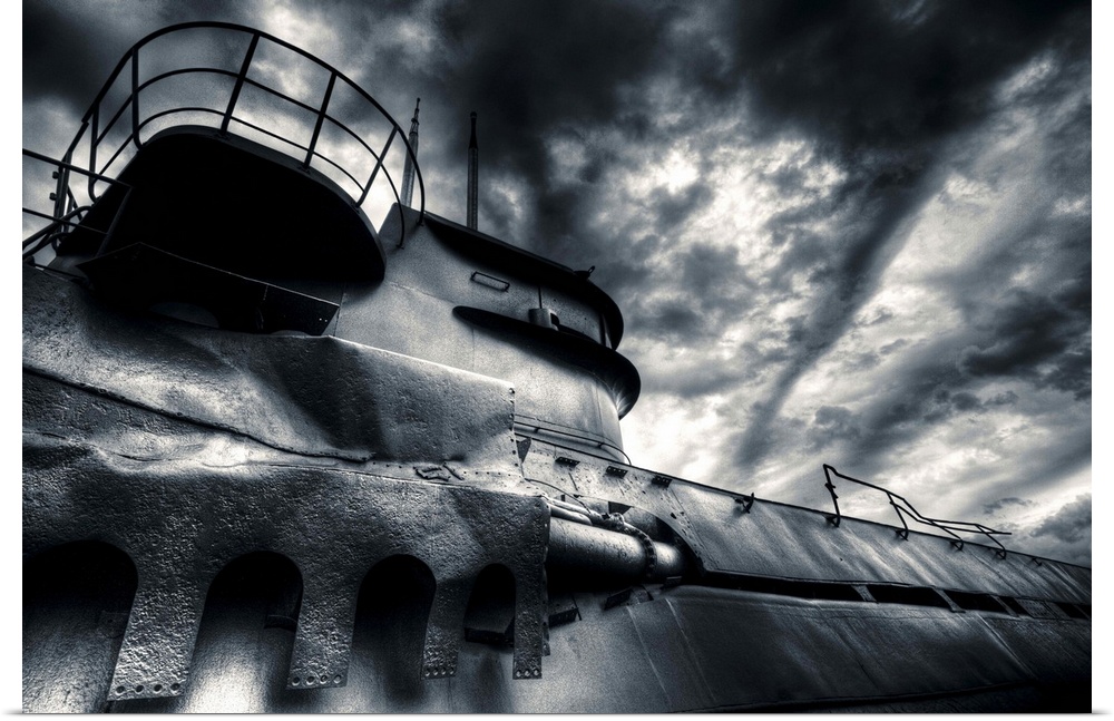 German U-boat under clouds that resemble waves at sea.