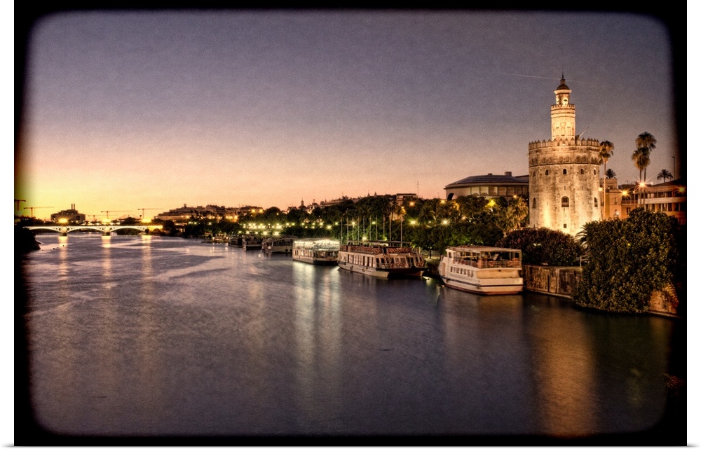 Torre del Oro (Golden Tower, 12th Century Moorish building) by the Guadalquivir river, Seville, Spain. Taken with tilted l...