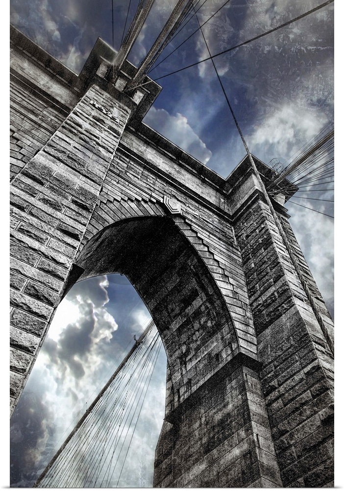 This large vertical piece is a photograph taken on the Brooklyn bridge and looking up toward the top of it.