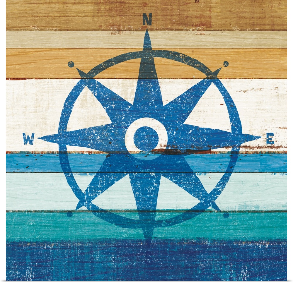 Blue rose compass on a blue and brown painted wood background.