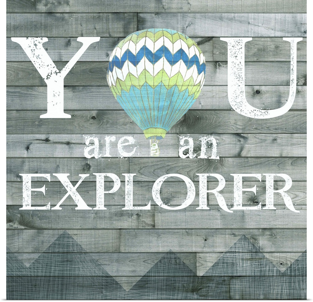 Inspirational decorative artwork of the phrase "You are an explorer" with a hot air balloon design.