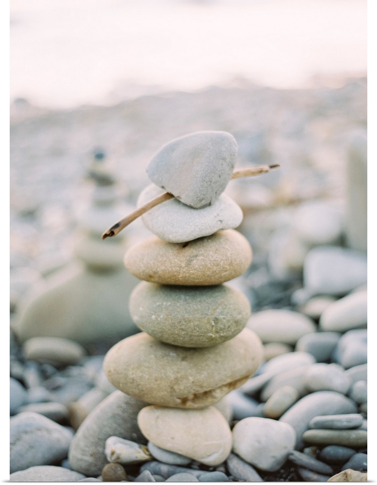 Photograph of stack of small pebbles on the beach, California.