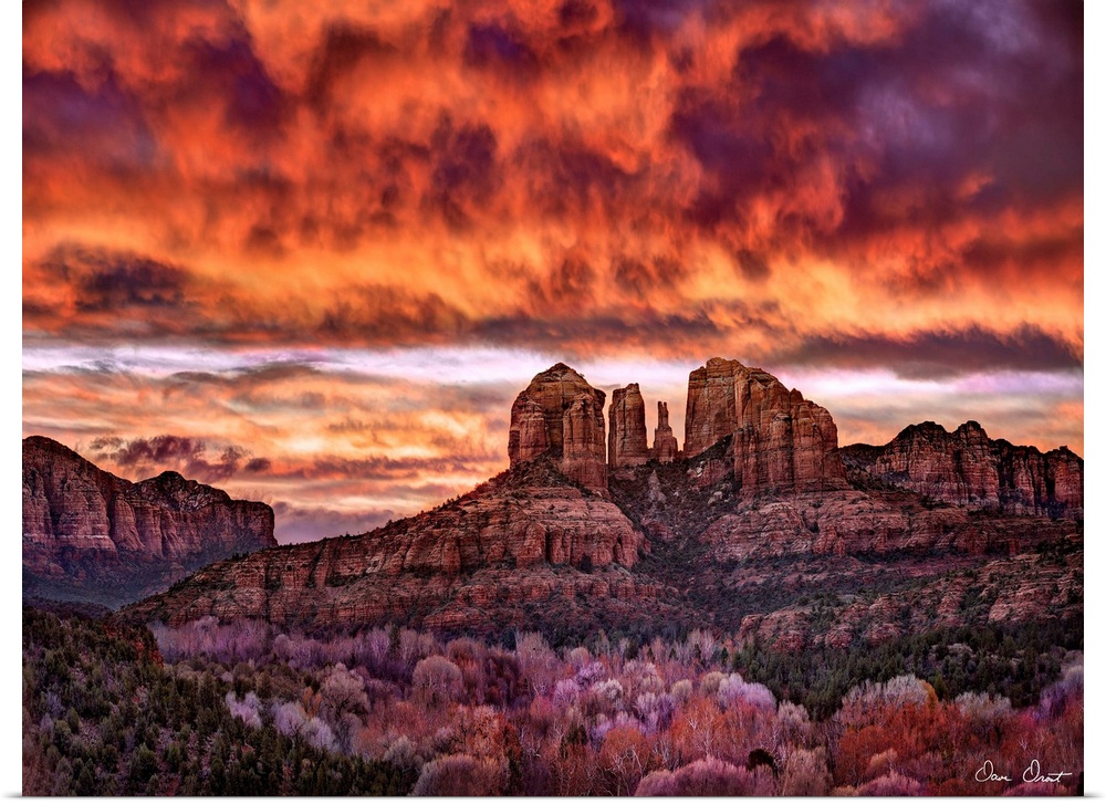 High definition photograph of sandstone canyons with a fire sky above.
