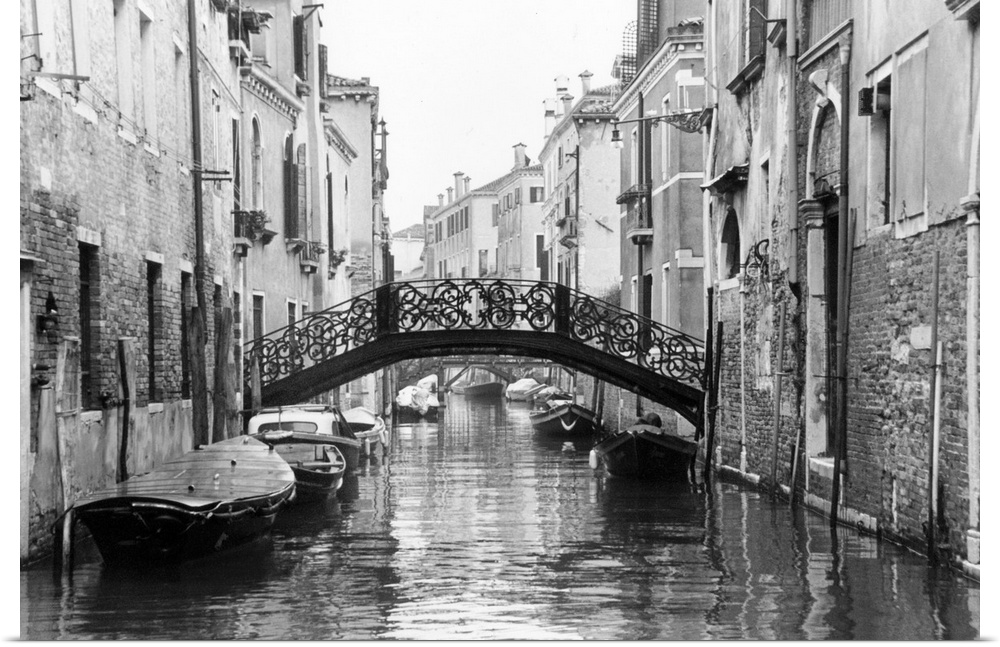 Large photo on canvas of gondolas lining a canal in Venice.