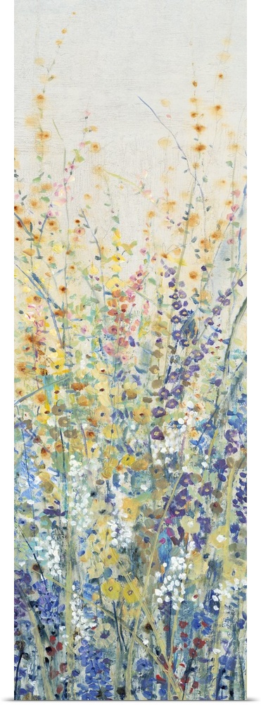 Vertical panel of blooming yellow and blue wildflowers in a field.