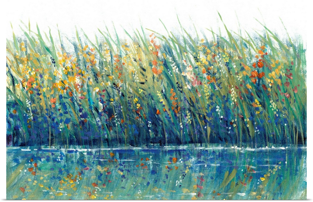 A mass of grasses and reeds interspersed with wild flowers on the edge of a lake or pond; the flowers are reflected in the...