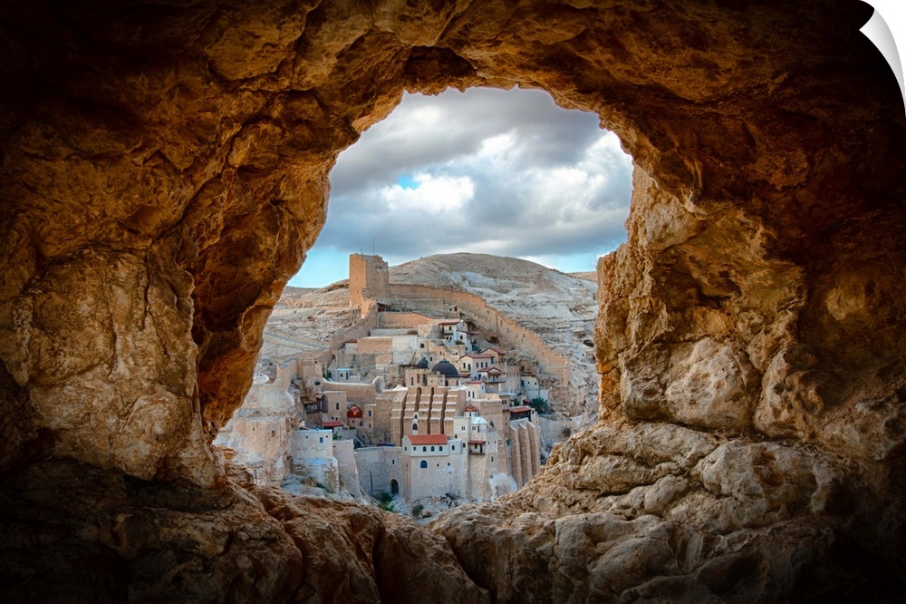 View of Mar Saba Monastery in Israel from a hole in a rocky wall.