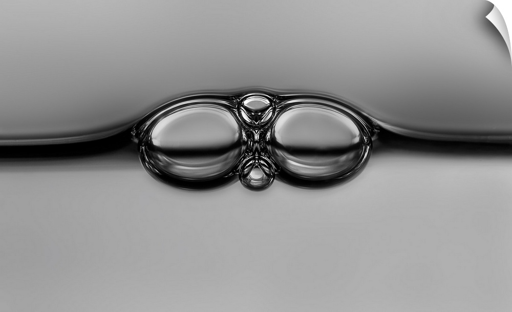 Bubbles in liquid resembling the shape of eyeglasses.