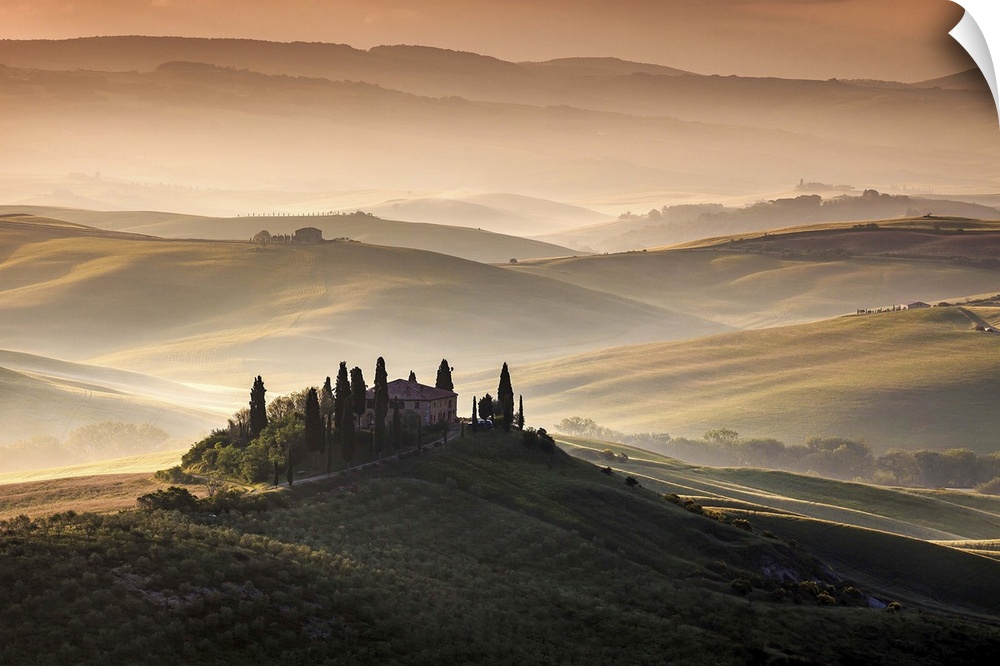 Idyllic landscape on a misty morning in the Tuscan countryside.
