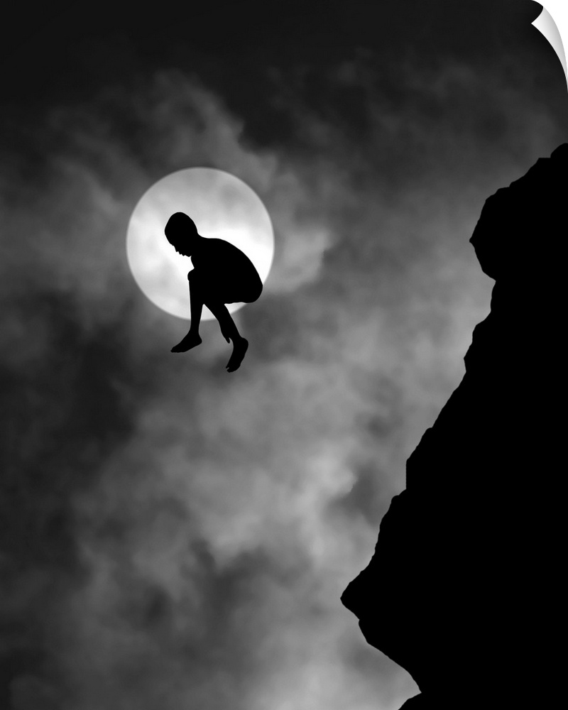Silhouette of a person jumping off a cliff, with the moon directly behind.