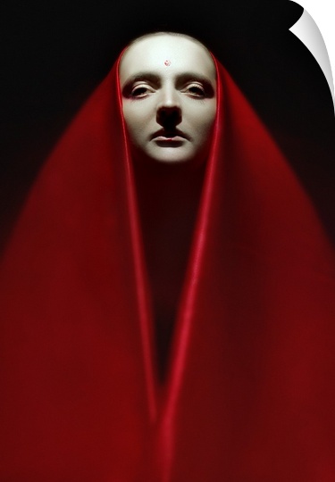 Portrait of a person wearing a long red veil over their head and around their body.