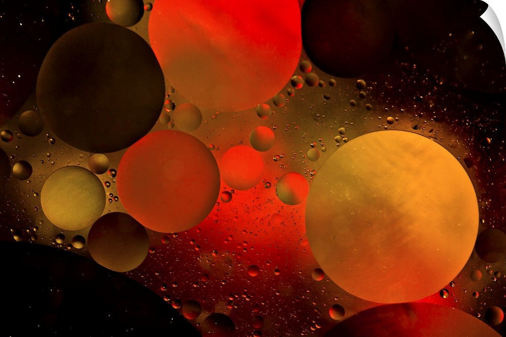 Abstract photograph of a warm red and orange colored water bubbles.