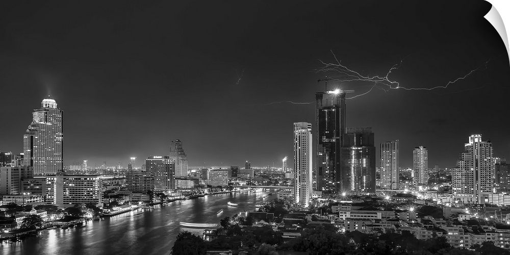 An aerial photograph of the Bangkok skyline with lightning overhead.