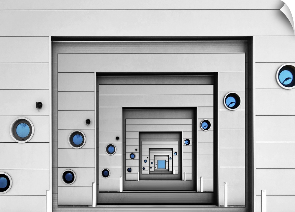 Conceptual image of a wall with blue portholes infinitely repeating itself.