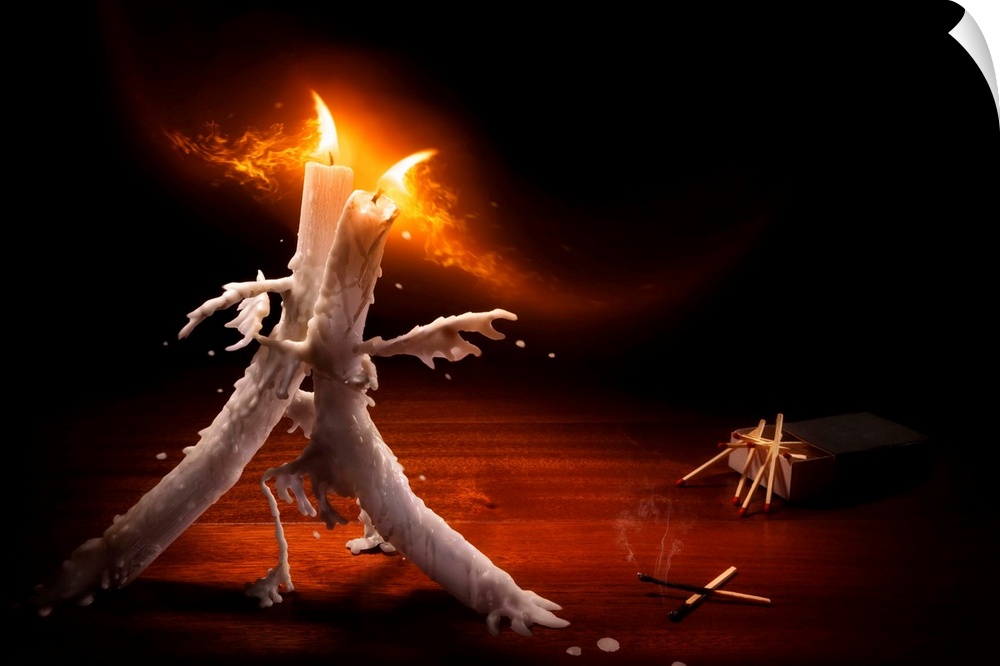 Conceptual image of two lit candles dancing with melting wax.